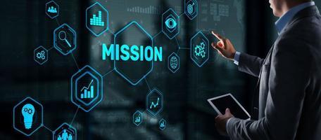 Business professional tapping a Mission icon among growth, target and teamwork icons